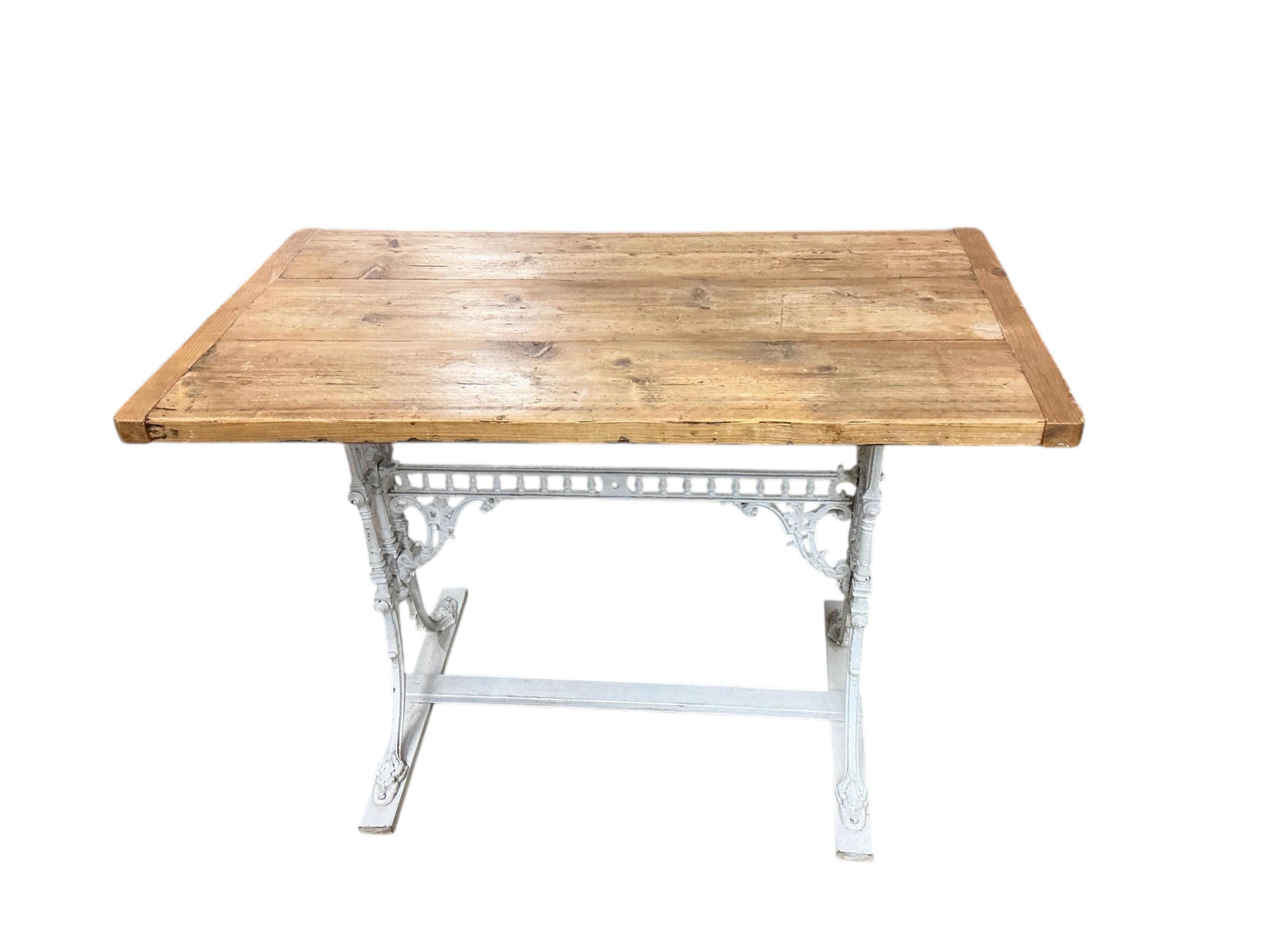 A Victorian painted cast iron table with rectangular pine top, width 110cm, depth 63cm, height 75cm